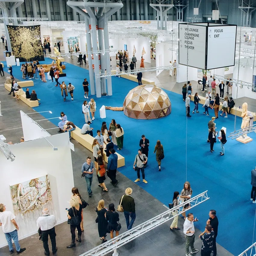 Large indoor art event with attendees