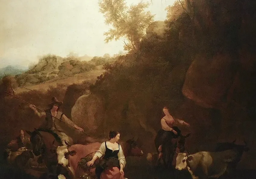 People tending goats in countryside setting