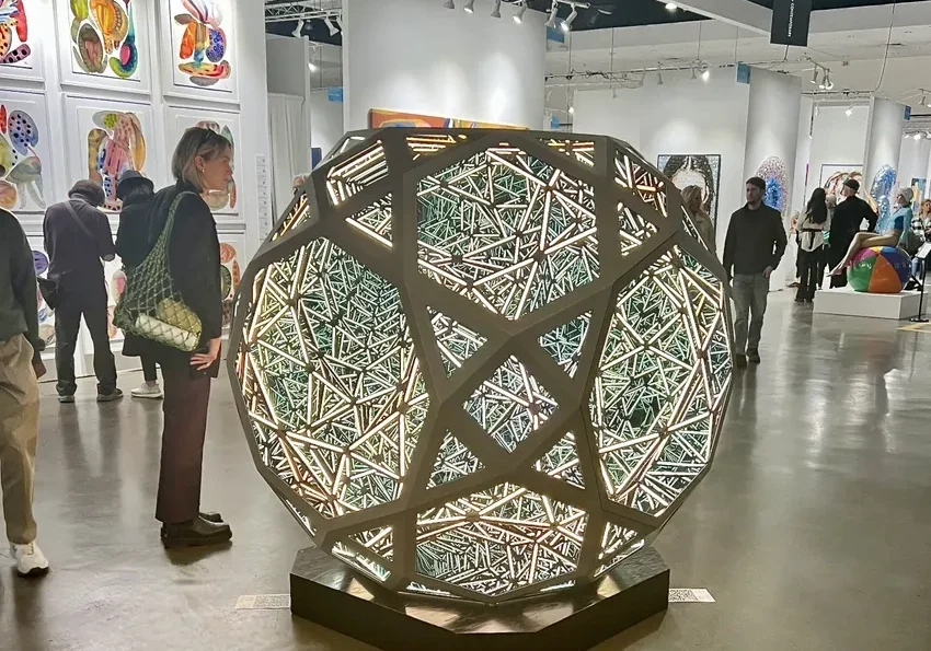 Illuminated geometric artwork on display