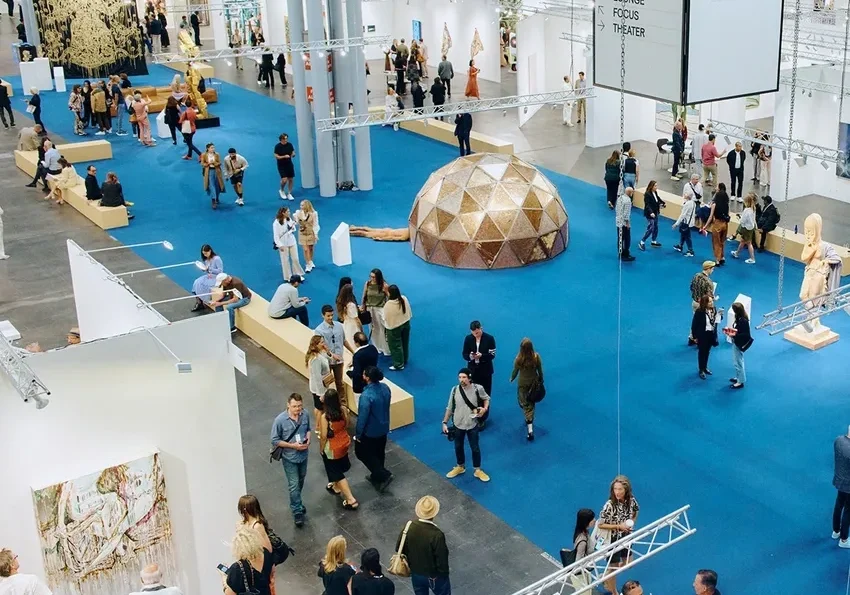 Large indoor art event with attendees