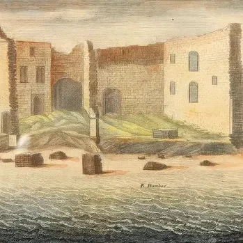Historic coastal castle with sailing ships