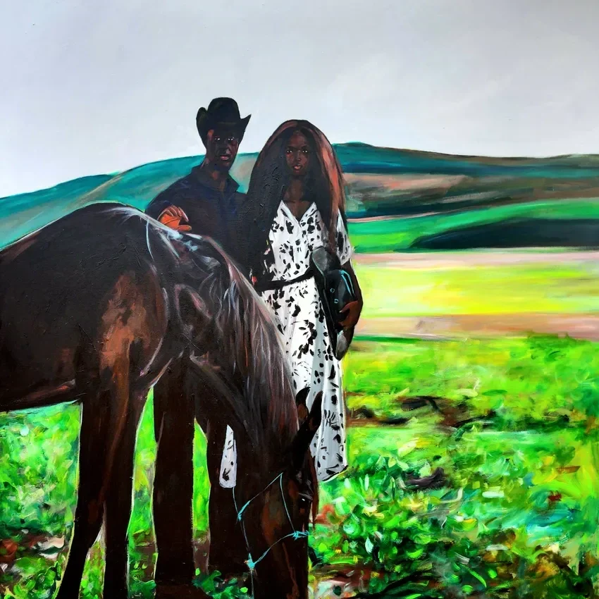 Cowboy and woman with horse in field