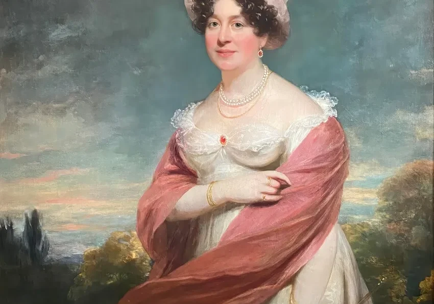 Portrait of woman in pink and white attire