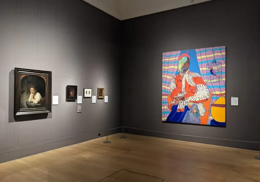 Art gallery with diverse paintings displayed.