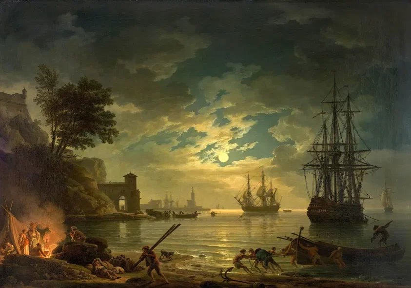 Nighttime coastal landscape with boats