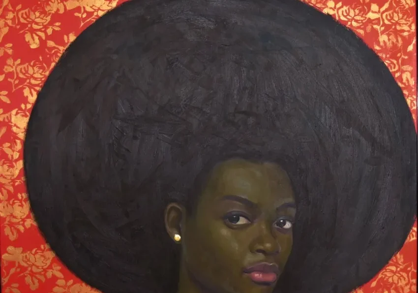 Woman with afro, red patterned backdrop
